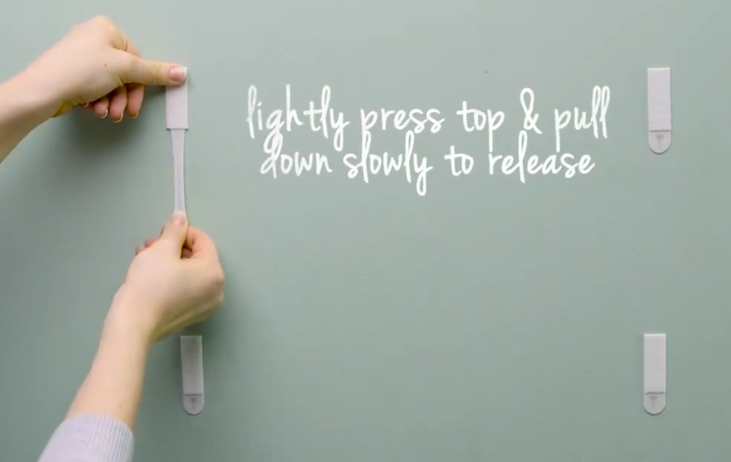 When removing, pull down the tab. 